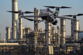 Symbolic image, photomontage, reconnaissance, spying with drones in industrial plants, critical