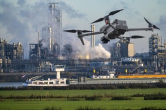 Symbolic image, photomontage, reconnaissance, spying with drones in industrial plants, critical