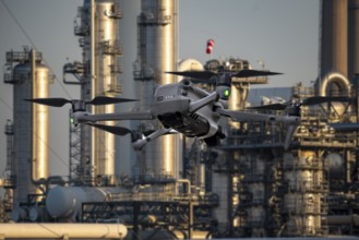 Symbolic image, photomontage, reconnaissance, spying with drones in industrial plants, critical