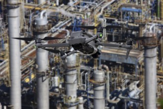 Symbolic image, photomontage, reconnaissance, spying with drones in industrial plants, critical