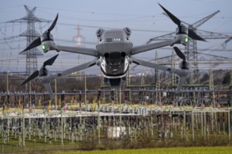 Symbolic image, photomontage, reconnaissance, spying with drones in industrial plants, critical