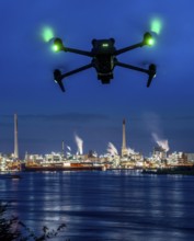 Symbolic image, photomontage, reconnaissance, spying with drones in industrial plants, critical