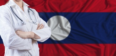 Doctor with crossed arms on Laos flag. Laotian health and care concept. Female doctor on Laos flag