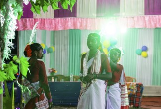 Members of the tea tribe community celebrate the vibrant Karam Festival at a tea estate in