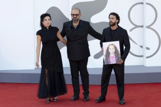 Venice, Italy - 3 September 2025: Clara Khoury, Amer Hlehel, Motaz Malhees with a portrait of