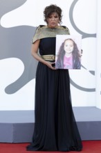 Venice, Italy - 3 September 2025: Kaouther Ben Hania with a portrait of five-year-old Palestinian