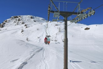 Chairlift, Alpe Tognola ski area, San Martino di Castrozza, Trentino, South Tyrol, Italy