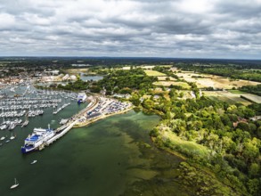 Wight Light car ferry to Isle of Wight on Lymington River and marina from drone, Lymington, New
