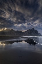 Mountains, mountain range, beach, sea, waves, surf, reflection, clouds, evening light, coast,