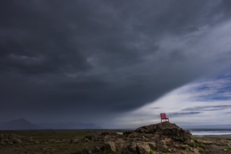 Red chair, artwork, rocks, clouds, storm, rain clouds, coast, mountains, summer, Lón, south-east