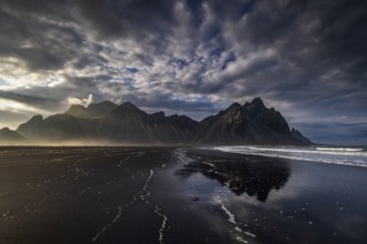 Mountains, mountain range, beach, sea, waves, surf, reflection, clouds, evening light, coast,