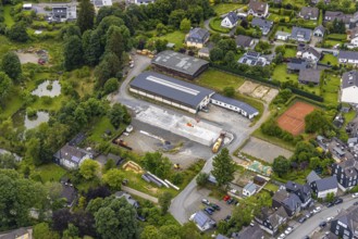 Aerial view, horse farm and riding stable, construction site with new building, tennis courts,