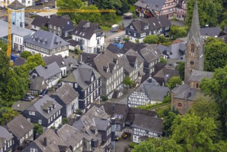 Aerial view, Protestant town church and green trees on Schlossstraße, residential area with