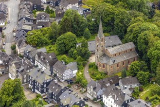 Aerial view, protestant town church and green trees on Schlossstraße, residential area with