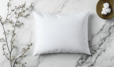 A white pillow sits on a marble countertop. The pillow is unmade and has a floral pattern on it.