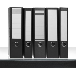 Some Folders on desk surface in white back