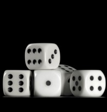Surface angle closeup studio photography of some dice in dark back
