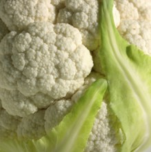 Full frame detail of a cauliflower and leaves