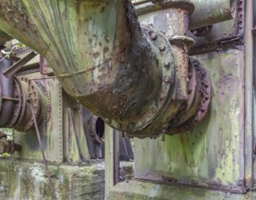 Weathered rundown industrial scenery with old corroded metal tubes