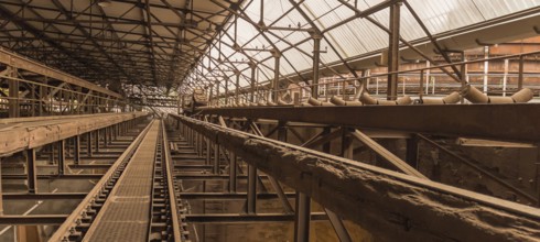 Weathered rusty industrial scenery with old rundown, steel girders and appliances