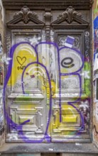 Entrance door covered by graffit at the Schanzenviertel in Hamburg, Germany