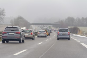 Misty highway scenery at winter time in Southern Germany