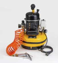 Yellow air compressor with orange tube in white back