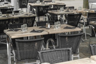 Outdoor scenery with tables and chairs seen in Normandy, France