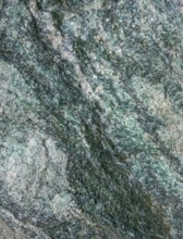 Full frame abstract marbled greenish mineral structure