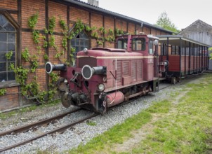 Nostalgic railway scenery with locomotive shed and locomotive