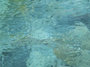 Full frame abstract blueish high angle water surface with little waves