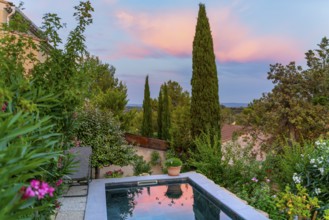 Idyllic scenery including a small swimming pool seen in Beaumes-de-Venise, a commune in the