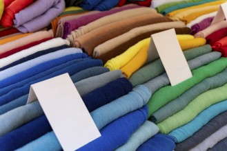 Full frame closeup shot showing a display of various colorful fabrics
