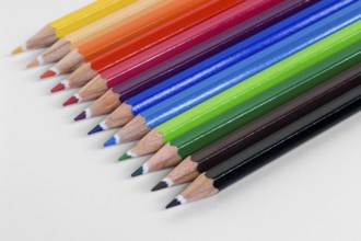 Detail shot of some colored pencils in light back