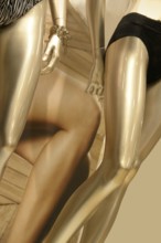 Setail of some golden female dummies and lingerie