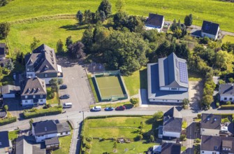 Aerial view, hall with solar roof on Christine-Koch-Straße and football pitch, Halberbracht,