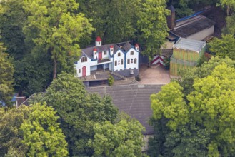 Aerial view, open-air stage covered by trees and neighbouring buildings with towers, Herdringen,