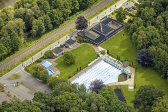 Aerial view, outdoor swimming pool Neheim, swimming pool without water, in the forest area at the