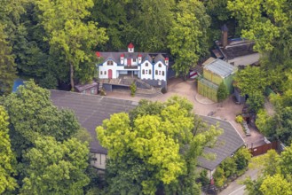 Aerial view, open-air stage covered by trees and neighbouring buildings with towers, Herdringen,