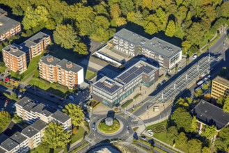 Aerial view, savings bank building at roundabout, residential area and high-rise buildings
