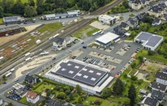 Aerial view, Bahnhofstrasse shopping centre with Rewe supermarket and solar roof, Takko fashion and