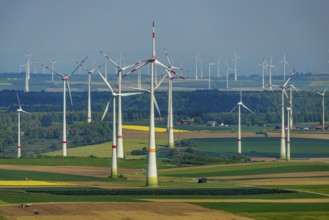 Aerial view, wind park and wind farm wind energy plant, wind turbines and rape fields near