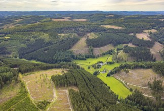 Aerial view, Homrighausen forester's lodge, half-timbered house in picturesque hilly landscape with