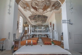 Interior of the Roman Catholic parish church of the Assumption of the Virgin Mary with organ loft