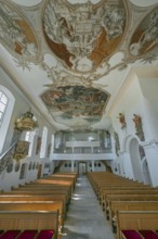 Interior of the Roman Catholic parish church of the Assumption of the Virgin Mary with organ loft