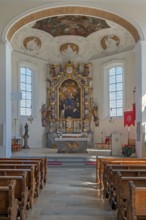 Interior of the Roman Catholic parish church of the Assumption of the Virgin Mary, main altar with