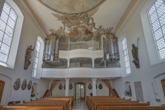 Interior of the Roman Catholic parish church of the Assumption of the Virgin Mary with organ loft