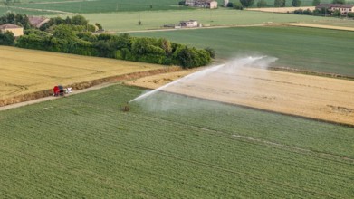 Modern agricultural irrigation technology applied to soybean crops utilizing a rain gun sprinkler