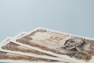Stack of old one hundred pesetas banknotes issued by bank of spain in 1970 featuring the portrait