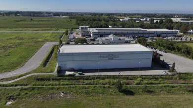 Cremona, Italy August 22nd 2025 Aerial view of the MicroData Group data center building,